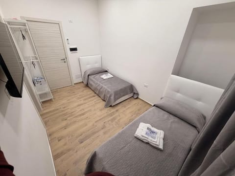 Twin Room, Courtyard View | Desk, blackout drapes, soundproofing, iron/ironing board
