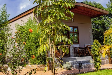 Deluxe Cottage, Patio, Pool View | Terrace/patio
