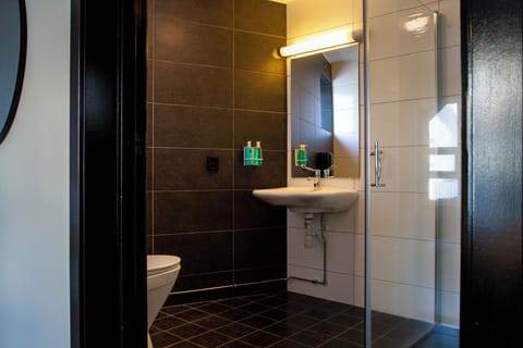 Economy Double Room | Bathroom | Eco-friendly toiletries, hair dryer, towels, soap