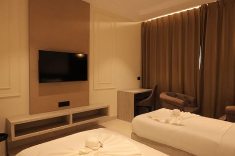 Deluxe Room | Laptop workspace, WiFi (free), bed sheets