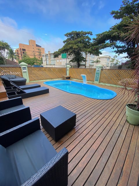 Outdoor pool, open 7:00 AM to 10:00 PM, sun loungers