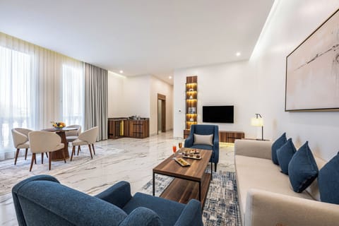 Panoramic Suite, City View | Living area | 40-inch flat-screen TV with satellite channels
