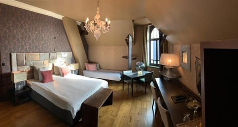 Deluxe Suite, Balcony, City View | Minibar, in-room safe, desk, laptop workspace