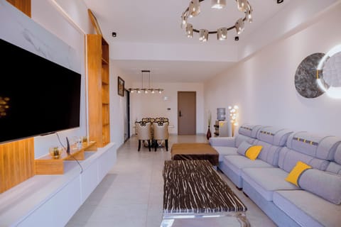 Executive Apartment, Balcony, Pool View | Living area | 55-inch Smart TV with cable channels, pay movies