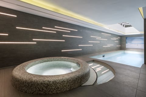 Indoor pool, open 9:00 AM to 10:00 PM, sun loungers