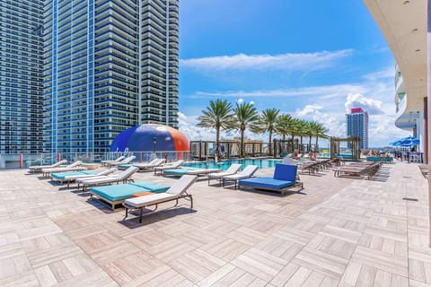 Outdoor pool, pool umbrellas, sun loungers