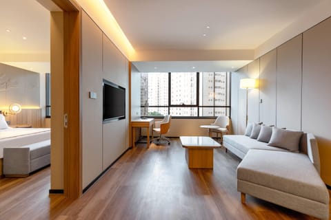Superior Suite, 1 King Bed, Non Smoking, City View | Minibar, in-room safe, blackout drapes, soundproofing