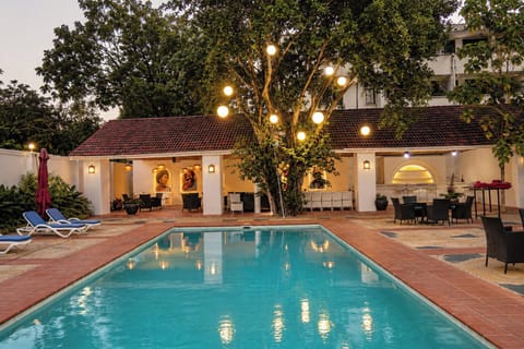 Outdoor pool, open 8:00 AM to 10:00 PM, pool umbrellas