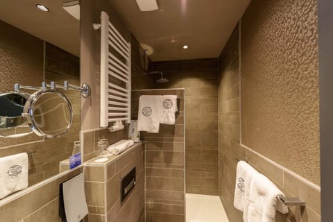 Shower, rainfall showerhead, hair dryer, towels