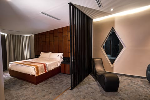 Luxury Suite | Living area | Flat-screen TV, DVD player