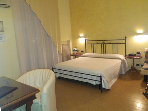 Standard Double or Twin Room | Minibar, in-room safe, blackout drapes, iron/ironing board