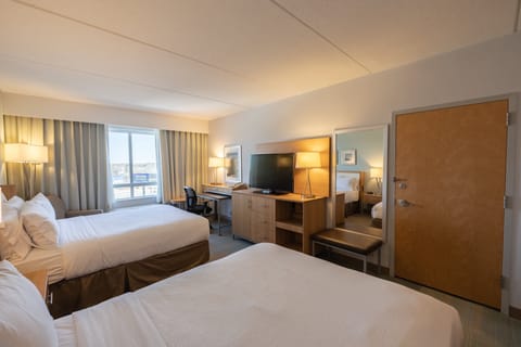 Premium bedding, memory foam beds, desk, laptop workspace