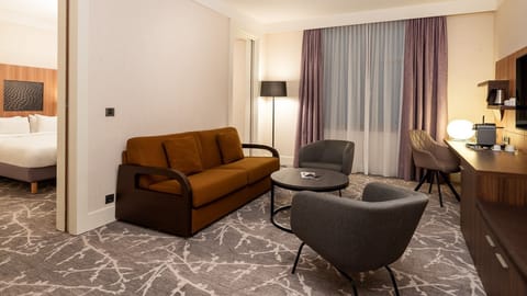 Junior Suite, 1 King Bed (living area) | Premium bedding, minibar, in-room safe, desk