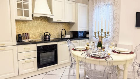Apartment (2 Bedrooms) | Private kitchen | Espresso maker, microwave, electric kettle, highchair