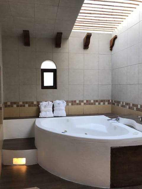 Premium Suite, 1 King Bed, Hot Tub, Lake View | Private spa tub