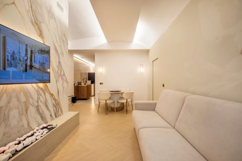 Luxury Apartment, 1 Queen Bed with Sofa bed, 2 Bathrooms | Living area | 55-inch Smart TV with digital channels, fireplace, heated floors