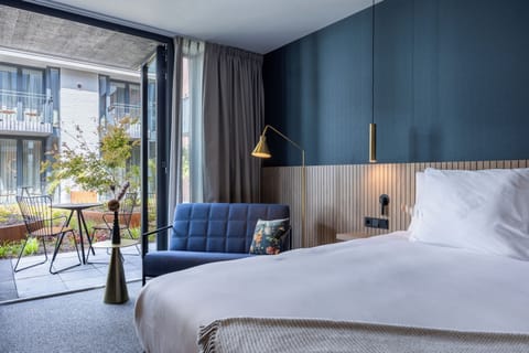 Superior Triple Room | Minibar, in-room safe, desk, laptop workspace