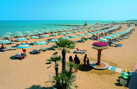 Private beach, white sand, sun loungers, beach umbrellas