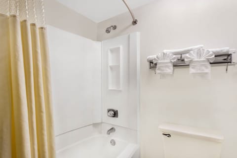 Desk, laptop workspace, blackout drapes, iron/ironing board