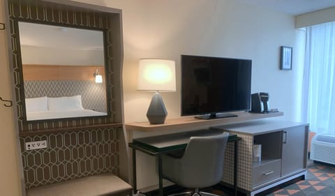 Hypo-allergenic bedding, desk, laptop workspace, blackout drapes