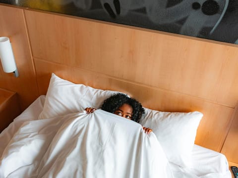 Premium bedding, desk, blackout drapes, soundproofing