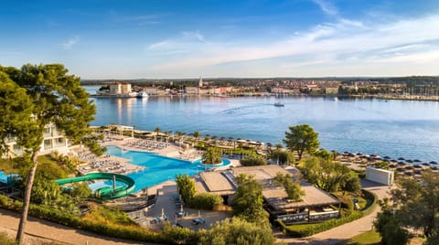 Indoor pool, seasonal outdoor pool, pool umbrellas, sun loungers