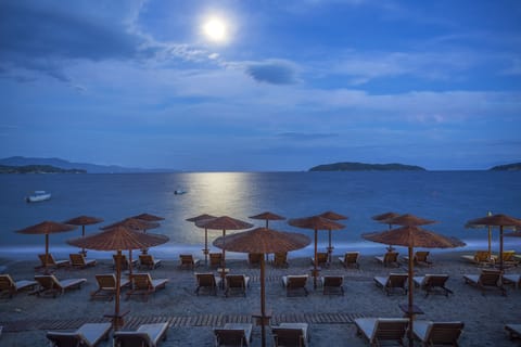 On the beach, sun loungers, beach umbrellas, beach towels