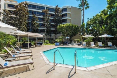 Outdoor pool, open 9:00 AM to 10:00 PM, pool umbrellas, sun loungers