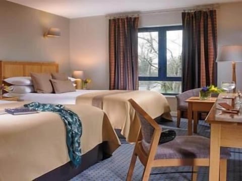 Family Room | Premium bedding, desk, laptop workspace, free WiFi