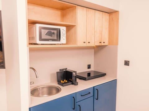 Blackout drapes, soundproofing, iron/ironing board, travel crib