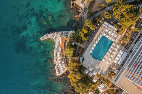 Indoor pool, seasonal outdoor pool, pool umbrellas, sun loungers