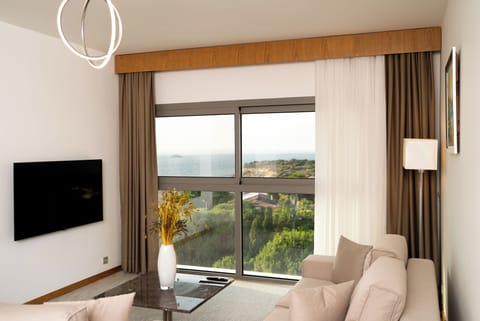 Executive Suite, Balcony, Sea View | Minibar, in-room safe, desk, laptop workspace