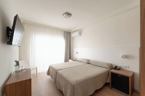 Minibar, desk, blackout drapes, iron/ironing board