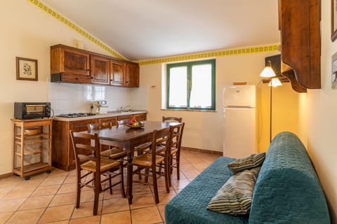 Apartment, 2 Bedrooms (Olivo B) | Living area | Flat-screen TV