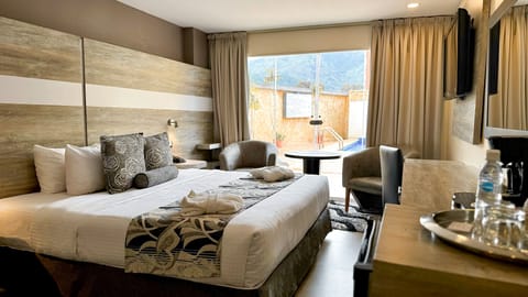 Deluxe Room, Balcony, Mountain View | Hypo-allergenic bedding available, down comforters, minibar