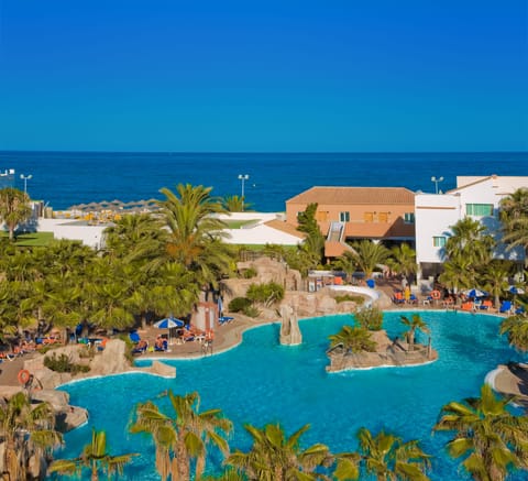 Indoor pool, outdoor pool, pool umbrellas, sun loungers