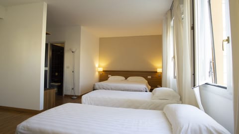 Classic Quadruple Room, Non Smoking | Minibar, in-room safe, desk, soundproofing