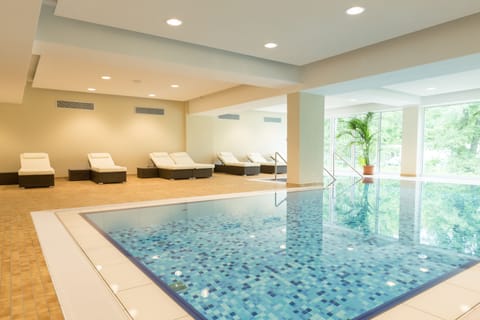 Indoor pool, open 7:00 AM to 8:00 PM, sun loungers
