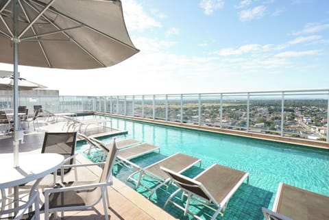 Outdoor pool, open 8:00 AM to 8:00 PM, pool umbrellas, sun loungers