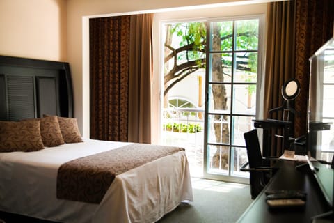 Deluxe Room | Individually furnished, laptop workspace, blackout drapes