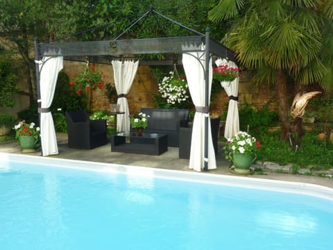 Seasonal outdoor pool, open 10:00 AM to 8:30 PM, pool umbrellas