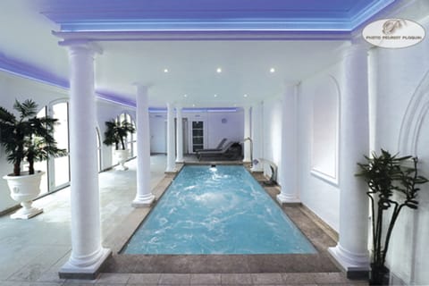 Indoor pool, pool umbrellas, sun loungers