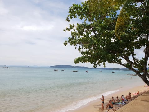 Beach nearby, white sand, beach towels