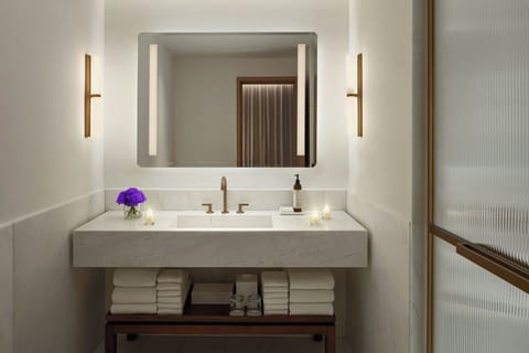 Designer toiletries, hair dryer, bathrobes, slippers