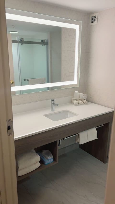 Combined shower/tub, hair dryer, towels, soap