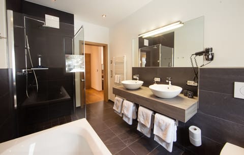 Apartment, 2 Bedrooms, Balcony (exkl. Final cleaning and city tax) | Bathroom amenities | Shower, rainfall showerhead, hair dryer, slippers