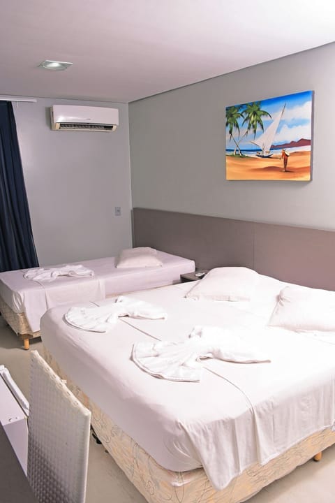 Family Room | Minibar, in-room safe, desk, blackout drapes