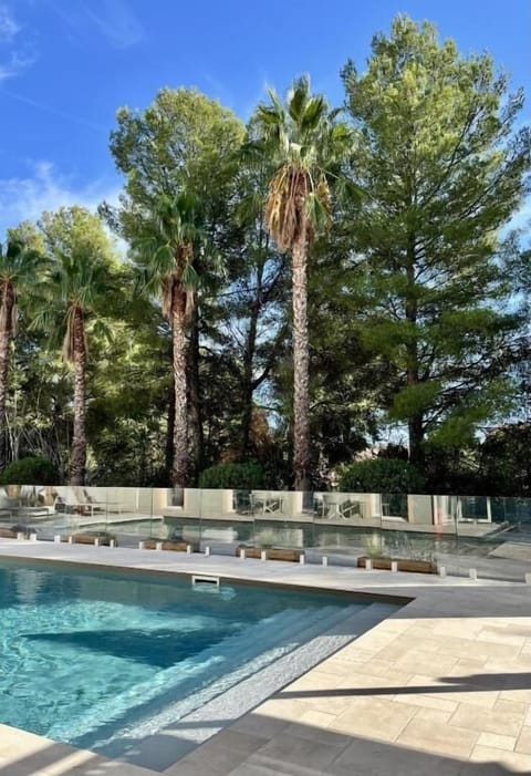 Seasonal outdoor pool, open 9:00 AM to 8:00 PM, pool umbrellas