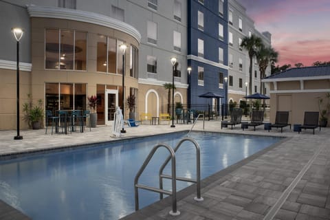 Outdoor pool, open 9:00 AM to 10:00 PM, sun loungers