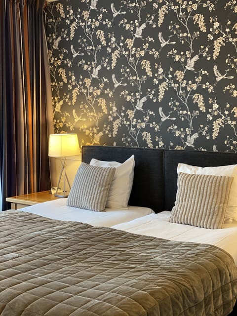 Down comforters, pillowtop beds, minibar, desk